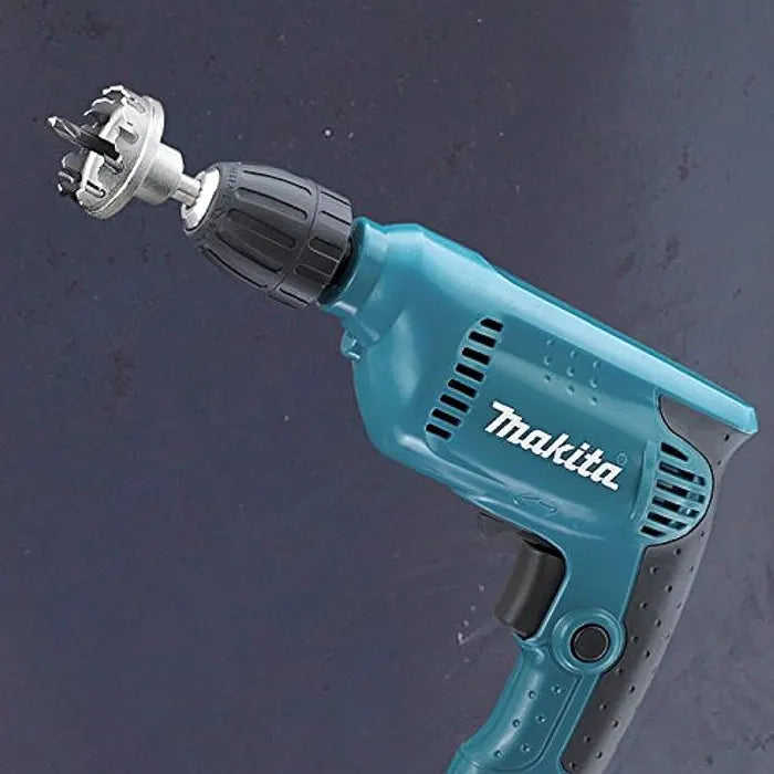 Blue Makita drill on a dark background
