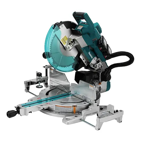 Makita miter saw with a teal and black motor housing, silver metal base, and a large circular blade with a translucent teal protective cover, shown on a plain white background.