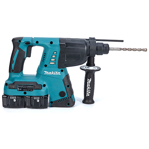 Makita cordless hammer drill with a black auxiliary handle, two battery packs, and a drill bit, shown on a white background.