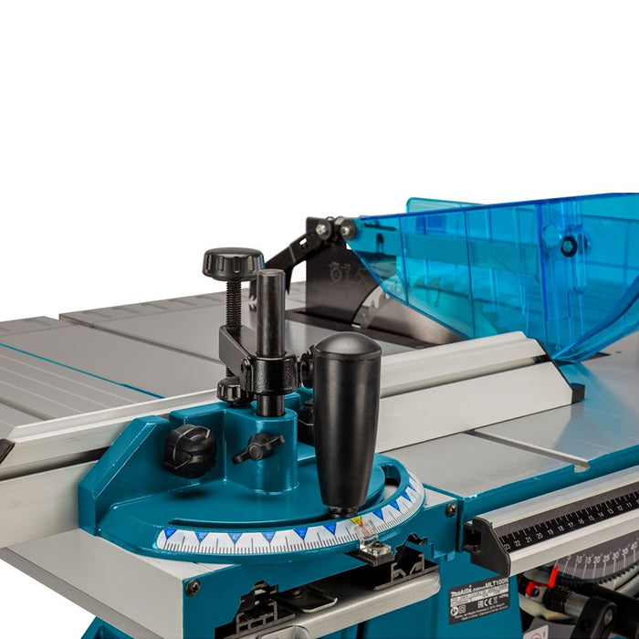 Close-up of a table saw with a teal and silver metal body, black adjustment knobs, and a translucent blue safety guard on a white background.