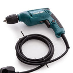 A teal and black Makita cordless drill with a coiled black power cord and plug, photographed on a clean white background.