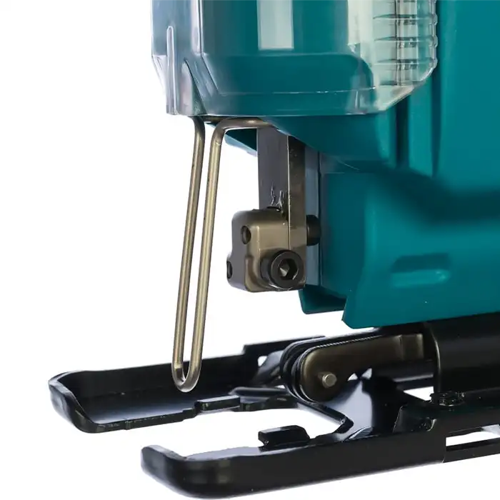 Close-up of a teal and black electric jigsaw saw with a clear dust collector and metal guide bar, shown against a white background.