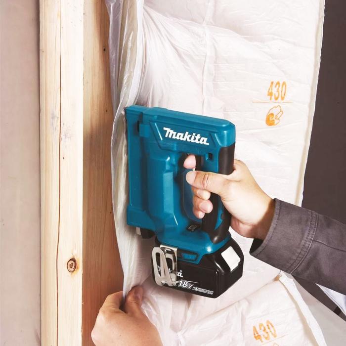 Person using a Makita Cordless Nailing Tool