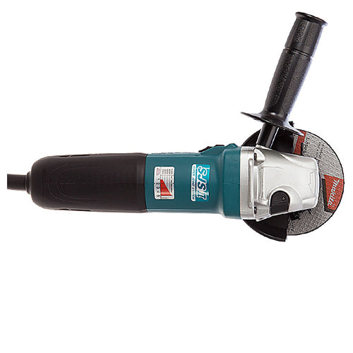A Makita angle grinder with a black and teal body, a silver metal guard, and a gray abrasive disc, shown from a side profile on a white background.