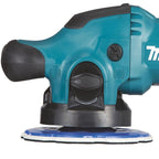 A teal and black Makita Car Shiner Machine with a blue and white sanding disc attached, shown against a plain white background. The Makita brand logo is partially visible on the side.