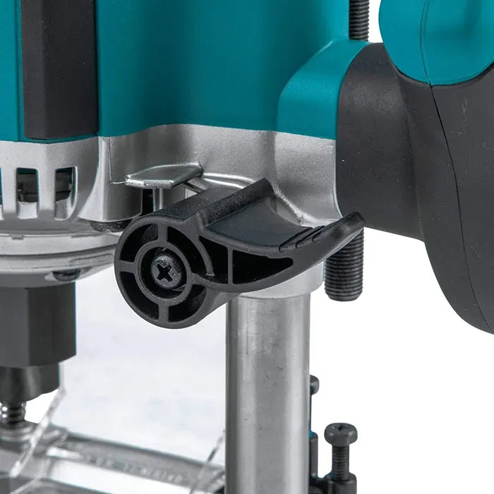 Close-up of a teal and silver Makita Wood Router Machine with a black plastic adjustment knob and guard, shown against a white background.