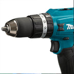 A close-up of a makita cordless drill driver with a teal and black body, showing the chuck, speed settings, and part of the Makita logo on a white background.
