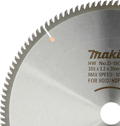 A close-up of a circular saw blade showing its serrated edge, brushed metal surface, and printed text including the Makita brand and model details.