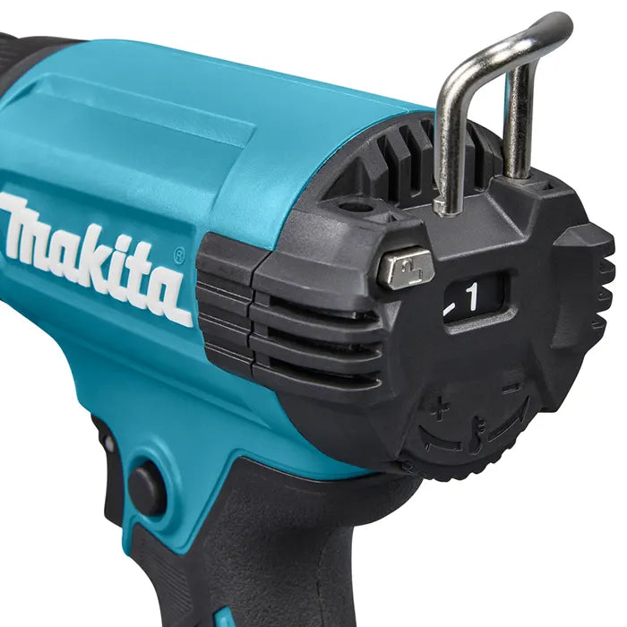 Close-up of a Makita cordless hot gun showing the teal and black body, vented housing, metal loop, and control markings on a white background.