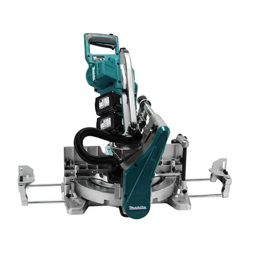 Makita miter saw with teal and silver components, black cords, and a black dust collection hose, shown on a solid white background.